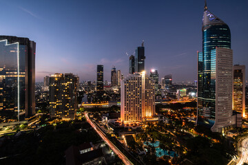 Fototapeta na wymiar Jakarta, Indonesia: Aerial view of the twilight over Jakarta business and financial district in Jakarta, Indonesia capital city in Southeast Asia
