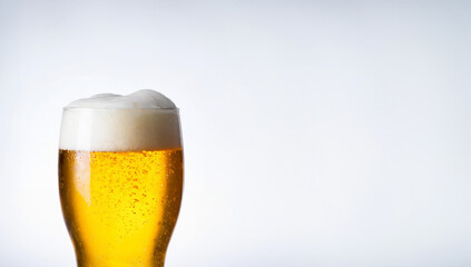 A refreshing glass of beer, isolated on a crisp white background, 
