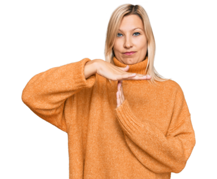 Middle age caucasian woman wearing casual winter sweater doing time out gesture with hands, frustrated and serious face