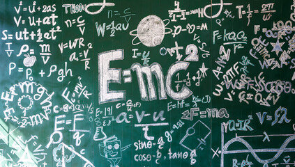 hand write physics formula and theory on chalkboard background