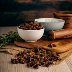 WHOLE STAR ANISE SPICE on wooden table background. Herbs, spices and dried food baking ingredient....