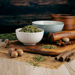 CHIVE FLAKES on wooden table background. Herbs, spices and dried food baking ingredient. Mortar and different spices. Cottage kitchen. Product Photography