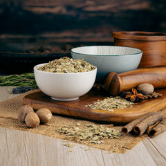 EUCALYPTUS LEAVES on wooden table background. Herbs, spices and dried food baking ingredient. Mortar and different spices. Cottage kitchen. Product Photography