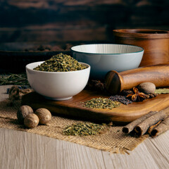 JALAPENO FLAKES GREEN on wooden table background. Herbs, spices and dried food baking ingredient. Mortar and different spices. Cottage kitchen. Product Photography