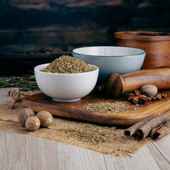 ITALIAN SEASONING on wooden table background. Herbs, spices and dried food baking ingredient. Mortar and different spices. Cottage kitchen. Product Photography