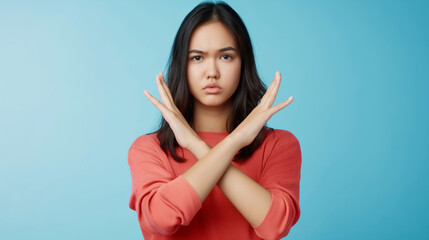 Young woman showing stop gesture