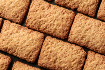 baby rusks or biscuits close-up food background, snack for infants transitioning to solid food with...