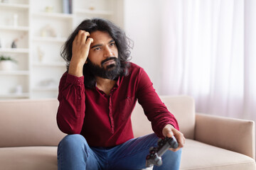 Man disappointed with video game loss at home