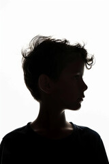 A dark silhouette figure of young boy on white background, with unclear face feature