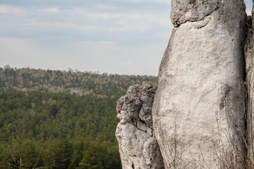 Closeup of a climbing rock against landscape view, the road prepared for climbing