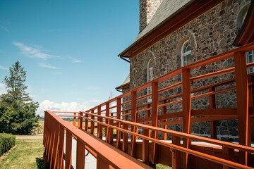Fototapeta premium Brick wall church and blue sky