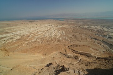 Aerial view of Masada with rocky ancient fortress and mountains in Israel