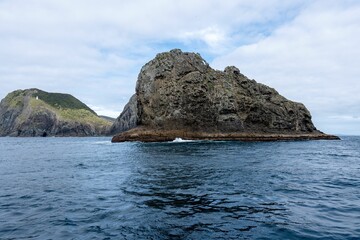 Fototapeta na wymiar Landscape view with of a hole in the rock, Piercy Island, New Zealand