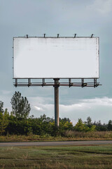 A blank billboard besides a road