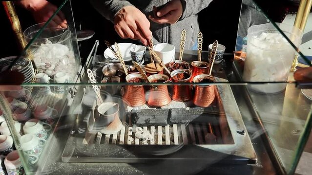 Man preparing turkish coffee on the street of Istanbul Turkey