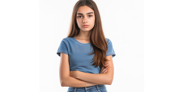 Portrait of an upset young casual girl standing with arms folded isolated over white background High resolution professional photography