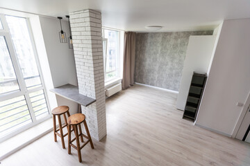 Interior of modern luxury apartment, empty attic, kitchen open space.
