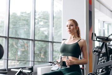Fototapeta premium woman trains in fitness gym