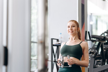 Fototapeta na wymiar woman trains in fitness gym