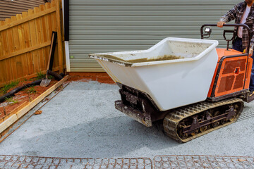 Utilization of self dumping rubber track concrete truck at construction site