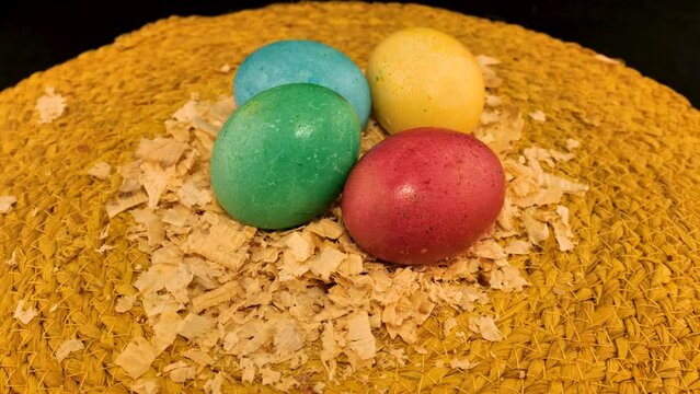 colorfully painted eggs in a wicker basket easter idea
