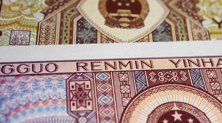 Closeup of old chinese Renminbi currency banknotes from 80s (focus on center)