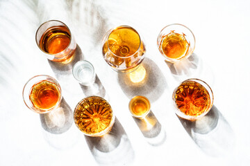 Strong alcohol drink. Whisky, rum, tequila, cognac at white background.