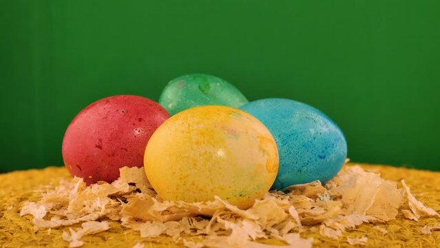 colorfully painted eggs in a wicker basket easter idea