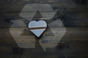 wooden heart with national flag of botswana near reduce, reuse and recycle sing on the wooden background. concept