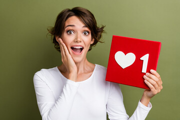 Photo portrait of lovely young lady excited shocked hold heart icon dressed stylish white garment...