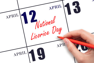 April 12. Hand writing text National Licorice Day on calendar date. Save the date.