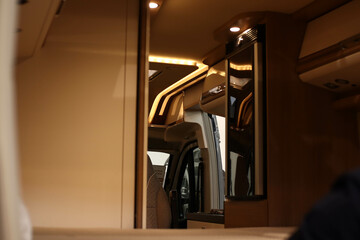Interior design of a bedroom in a motorhome on wheels. Caravan, camper. Mobile