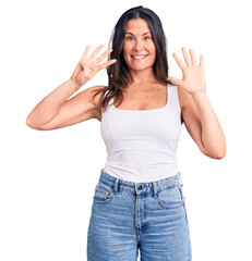 Obraz na płótnie Canvas Young beautiful brunette woman wearing casual sleeveless t-shirt showing and pointing up with fingers number nine while smiling confident and happy.