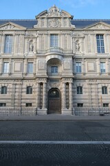Naklejka premium Vertical shot of the famous Louvre museum in Paris, France