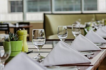 Napkin, wine glasses, glasses, restaurant glass, salt and pepper mill on restaurant table
