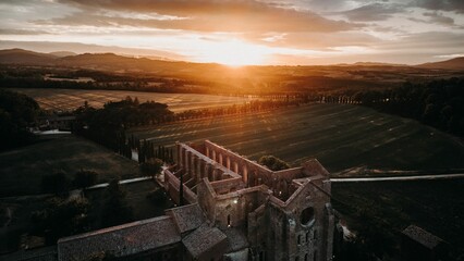 Aerial view of the walls of the Gothic-style church of San Galgano, in Chiusdino, Siena, Italy - obrazy, fototapety, plakaty