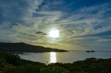 Beautiful view of a sea with boats from an island during sunrise