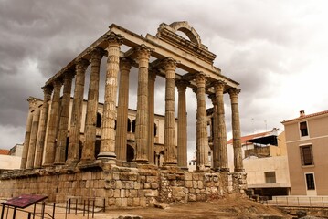 Scenic shot of the Templo de Diana with the grey gloomy clouds in the background