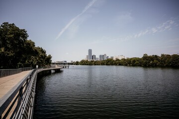 Beautiful shot of an embankment with the background of a cityscape