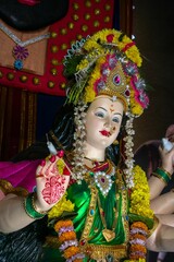 Fototapeta na wymiar Vertical shot of the idol of Maa Durga being worshipped at a Mandal in Mumbai, India, for Navratri