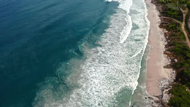 Aerial drone footage of Punta Mita beach in Jalisco, Mexico with blue ocean waves