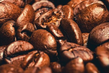 Closeup shot of a group of brown coffee beans.