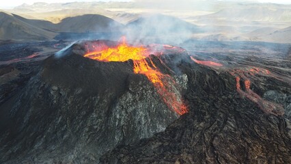 Landscape of lightening erupting from Mauna Loa Volcano in Hawaii with smoke and a hazy sky © Wirestock