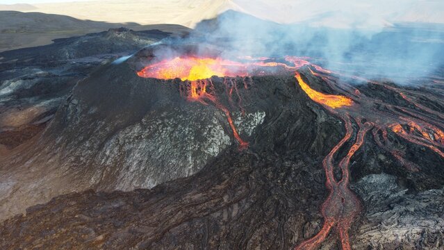 Landscape of lightening erupting from Mauna Loa Volcano in Hawaii with smoke and a hazy sky