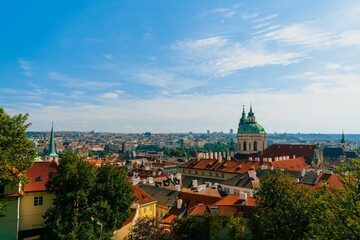 Naklejka na ściany i meble Beautiful view of the Prague cityscape under a blue sky