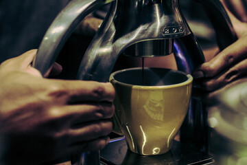 Fototapeta na wymiar barista making a cup of latte coffee