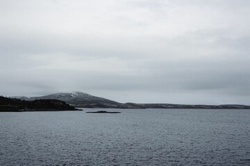 View of the ocean surrounding the city of Murmansk, Russia on a gloomy, overcast day