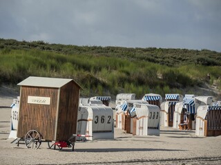 Strandkorbs, special hooded windbreak seating furniture captured along a beach