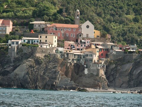 Coastal Italian Village cinque terre by the water under wood trees