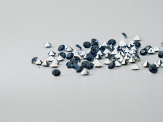 Heap of blue sapphires on a clean white backdrop